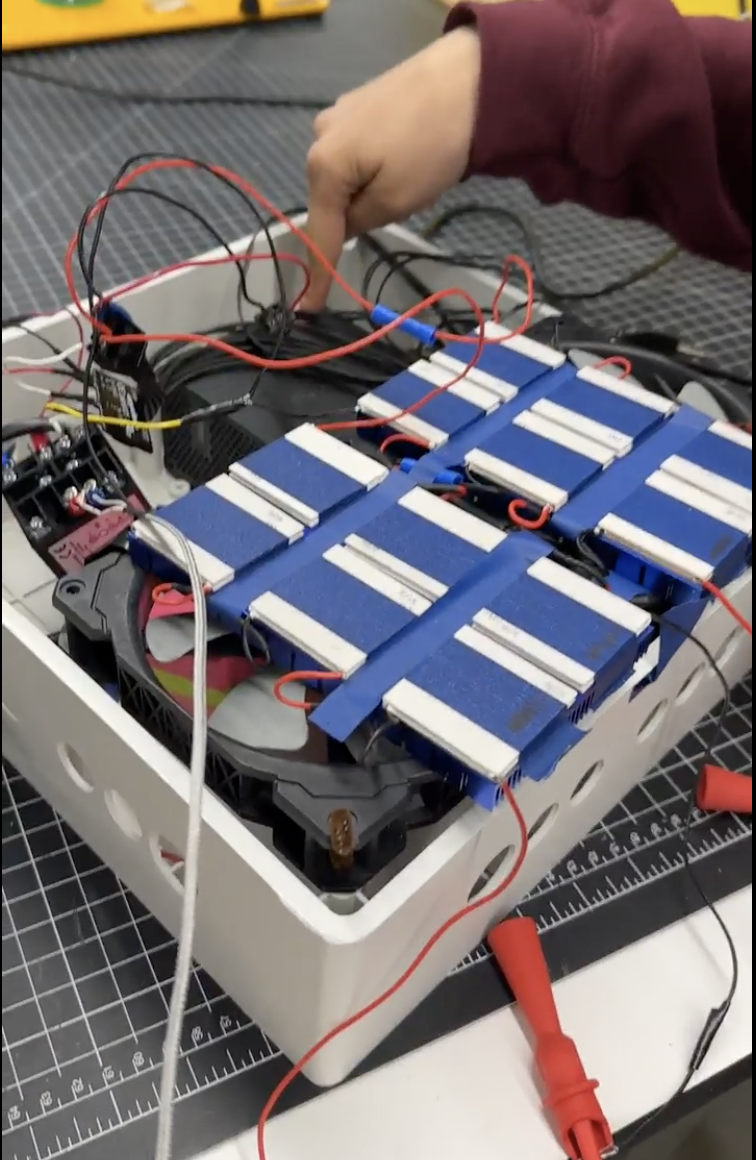 Neonatal Asphyxia Project device prototype showing electronic components and cooling system