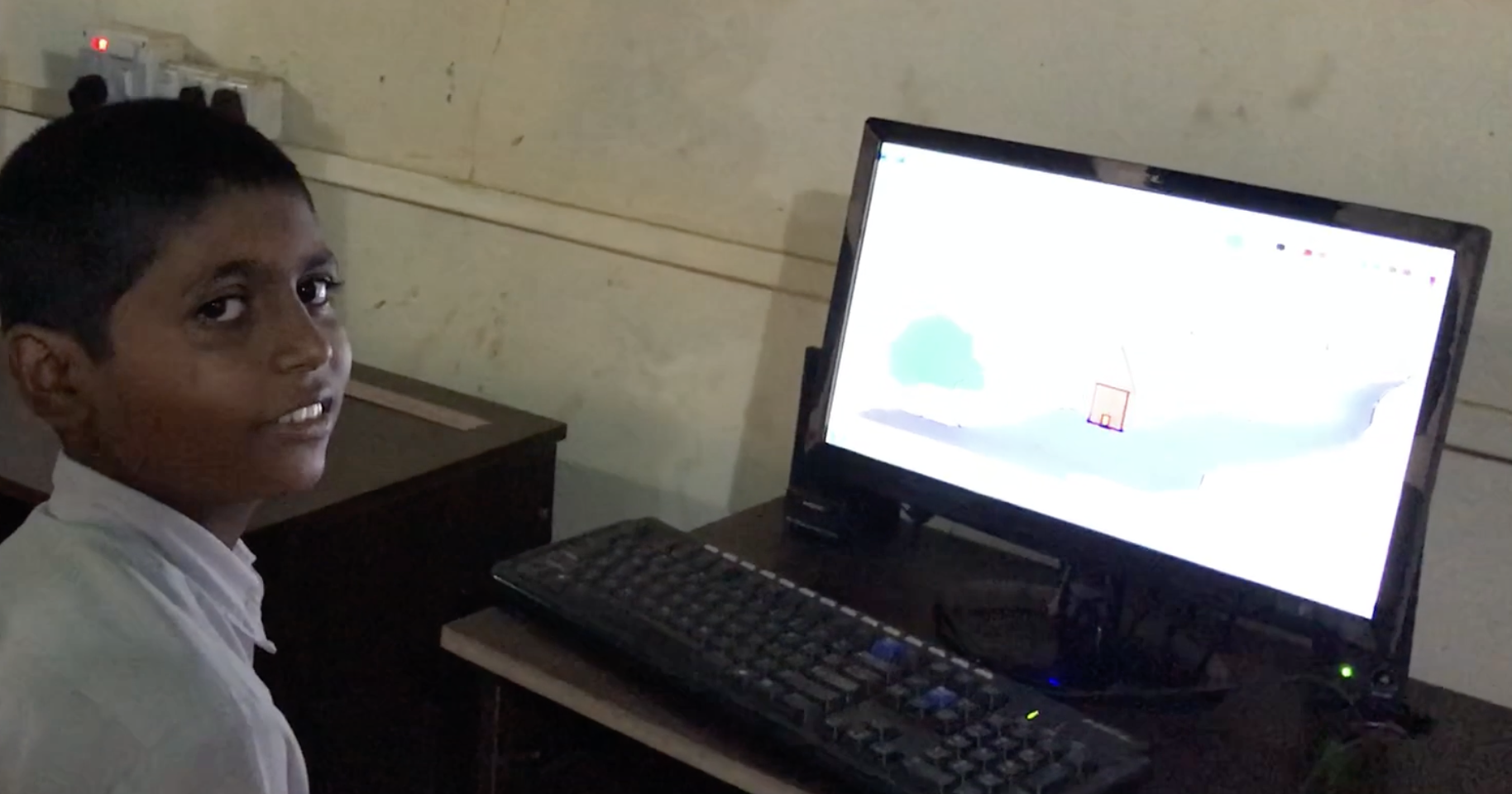 Student in Adkur, India learning with computer technology
